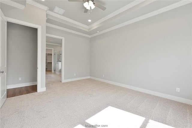 unfurnished bedroom with ceiling fan, crown molding, and light colored carpet