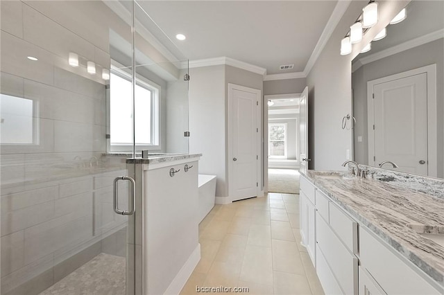 bathroom featuring plus walk in shower, vanity, crown molding, and tile patterned flooring