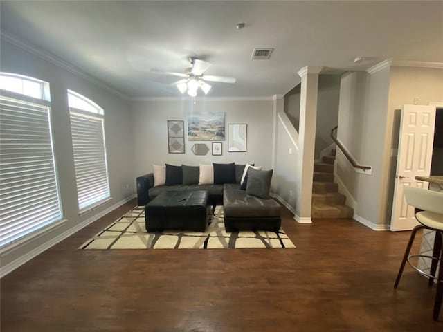 living room with ceiling fan, dark wood-type flooring, and crown molding