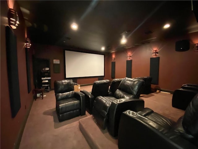 home theater room with light colored carpet