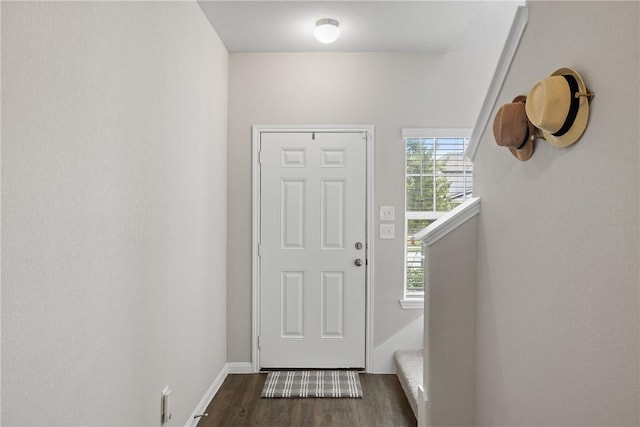 5745 Cerrillos Dr, Bryan, TX 77807 - entryway with dark wood-style flooring and baseboards