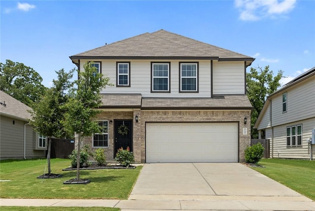 5745 Cerrillos Dr, Bryan, TX 77807 - view of front of home with brick siding, an attached garage, roof with shingles, and concrete driveway