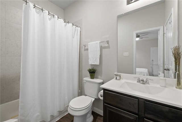 5745 Cerrillos Dr, Bryan, TX 77807 - full bathroom featuring vanity, toilet, a ceiling fan, shower / bath combo, and wood finished floors
