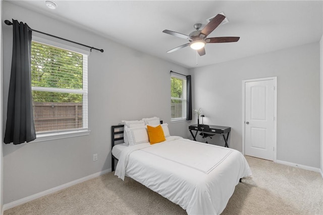 5745 Cerrillos Dr, Bryan, TX 77807 - bedroom with light carpet, baseboards, and ceiling fan
