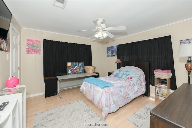 bedroom with ceiling fan, light hardwood / wood-style flooring, and crown molding