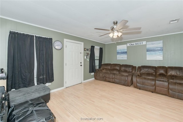 living room with ceiling fan, light hardwood / wood-style floors, and ornamental molding