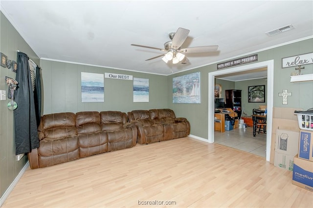 living room featuring ceiling fan, light hardwood / wood-style flooring, and crown molding