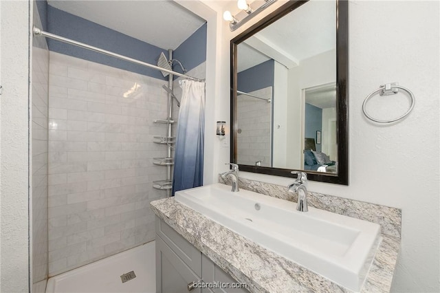 bathroom with a shower with curtain and vanity