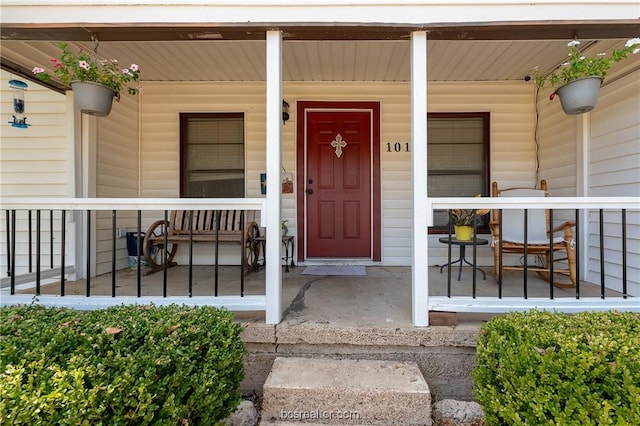 entrance to property featuring a porch