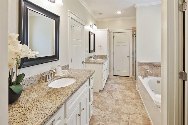 bathroom featuring a relaxing tiled tub, ornamental molding, and vanity