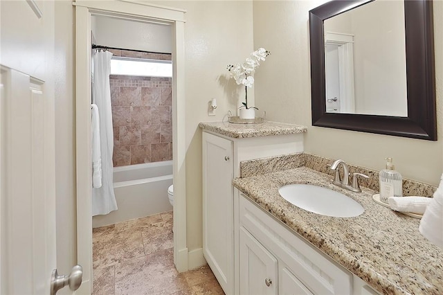 full bathroom with vanity, toilet, and shower / bath combo with shower curtain