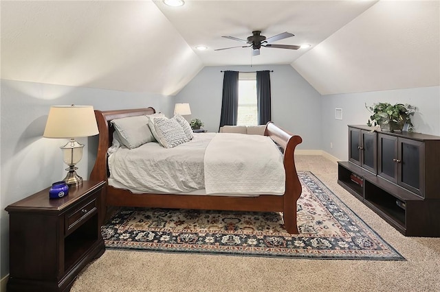 carpeted bedroom with lofted ceiling and ceiling fan