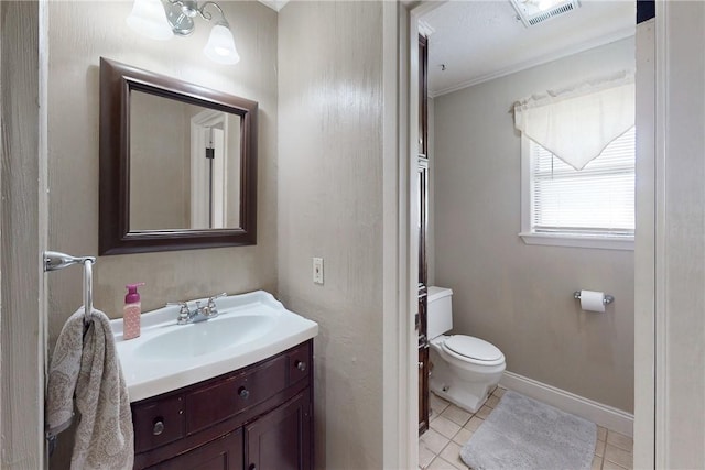 half bath featuring vanity, toilet, tile patterned floors, baseboards, and visible vents