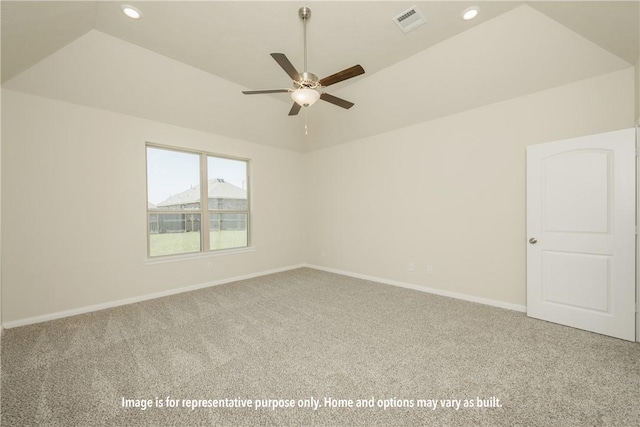 unfurnished room with ceiling fan, carpet floors, and vaulted ceiling