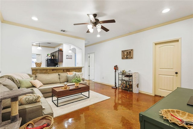 living area with arched walkways, ceiling fan, baseboards, and recessed lighting