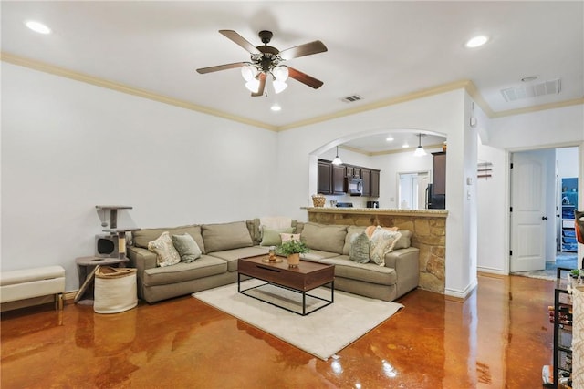 living room with concrete flooring, a ceiling fan, and visible vents