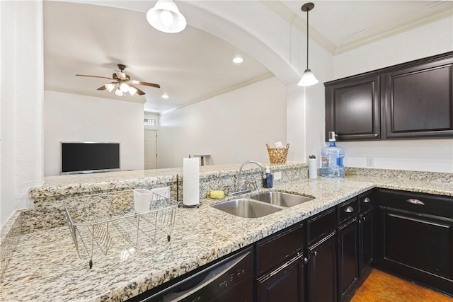 kitchen with light stone countertops, arched walkways, a ceiling fan, ornamental molding, and a sink