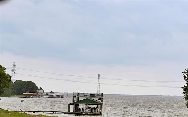 property view of water with a dock