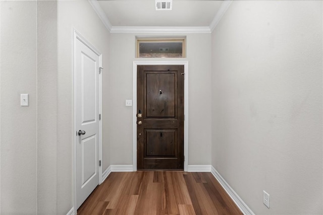 3008 Alpha Ct, Bryan, TX 77808 - entrance foyer with wood finished floors, baseboards, and crown molding