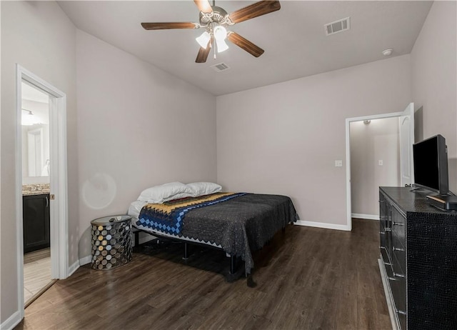 bedroom with dark hardwood / wood-style flooring and ceiling fan