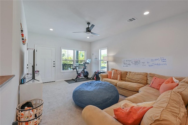 carpeted living room featuring recessed lighting, visible vents, a ceiling fan, and baseboards