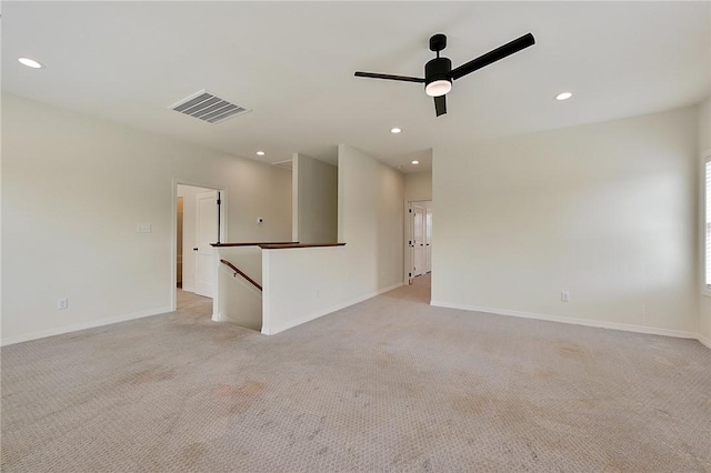 unfurnished room featuring recessed lighting, visible vents, a ceiling fan, and light carpet