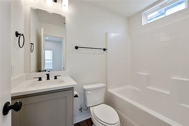 full bathroom with shower / bathtub combination, vanity, a wealth of natural light, and toilet