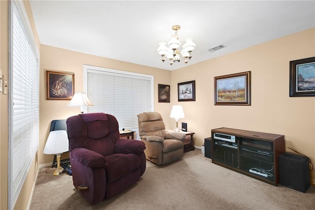 sitting room featuring baseboards, carpet floors, visible vents, and an inviting chandelier