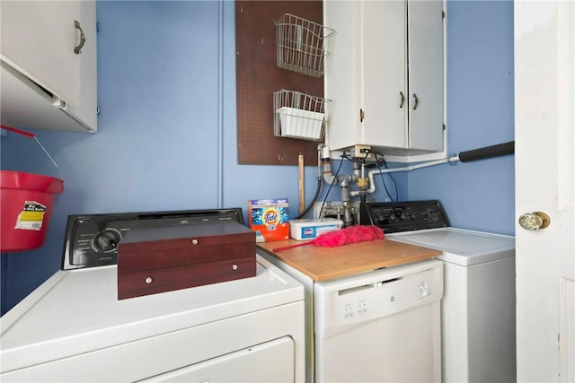 laundry area with cabinet space and washer and clothes dryer