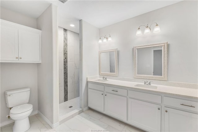full bath featuring a sink, baseboards, toilet, and marble finish floor