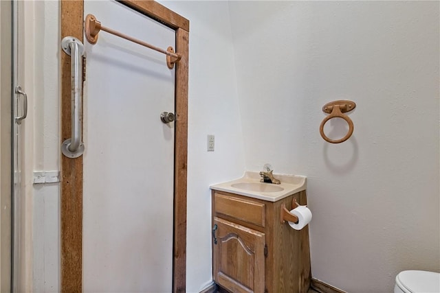 bathroom with vanity and toilet