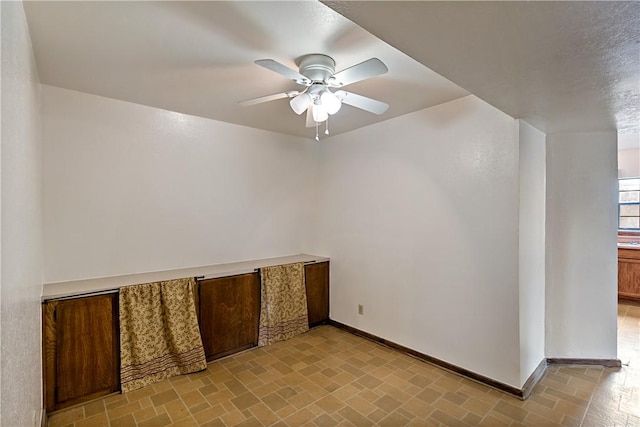 spare room featuring ceiling fan