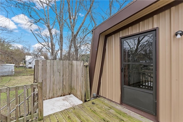 view of exterior entry with a deck