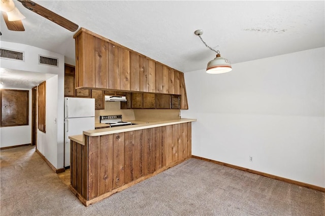 kitchen featuring hanging light fixtures, light carpet, kitchen peninsula, white refrigerator, and electric range oven