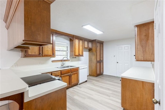 kitchen with black electric stovetop, dishwasher, sink, and light hardwood / wood-style flooring