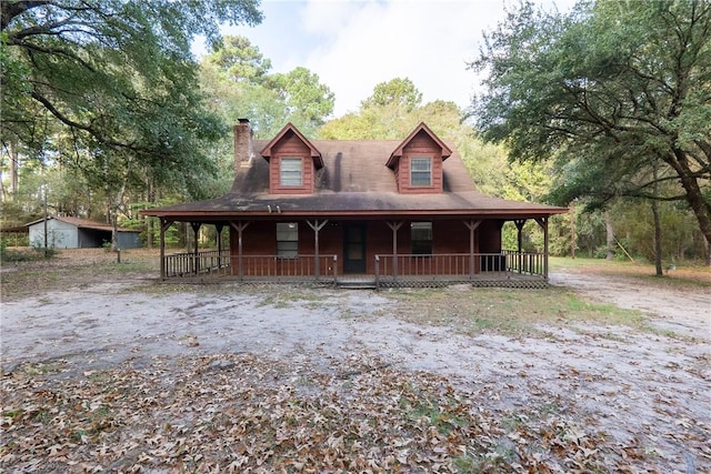 country-style home featuring a porch