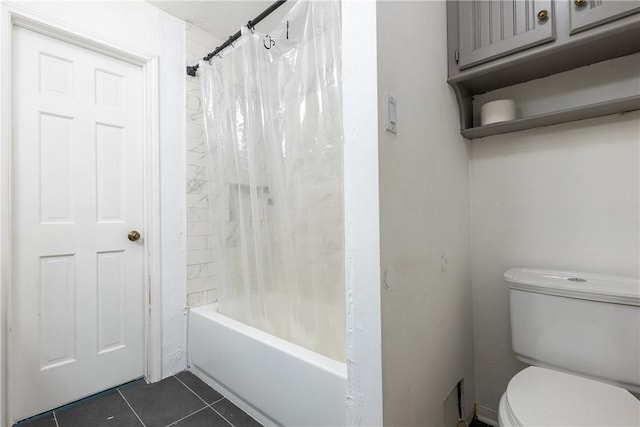 bathroom with toilet, tile patterned floors, and shower / bathtub combination with curtain