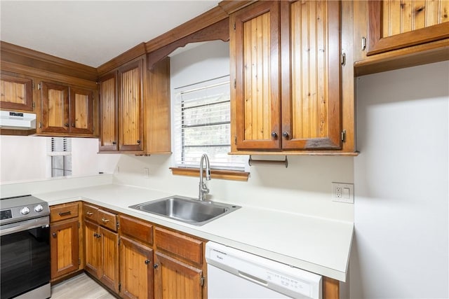 kitchen with sink, white dishwasher, and electric stove