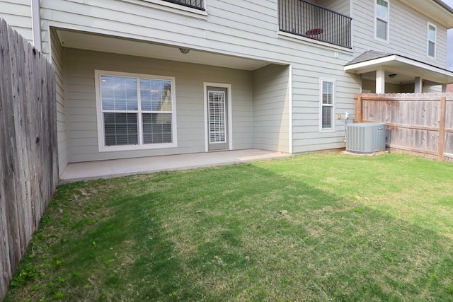 exterior space with a yard and central air condition unit