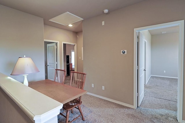 office area featuring light carpet