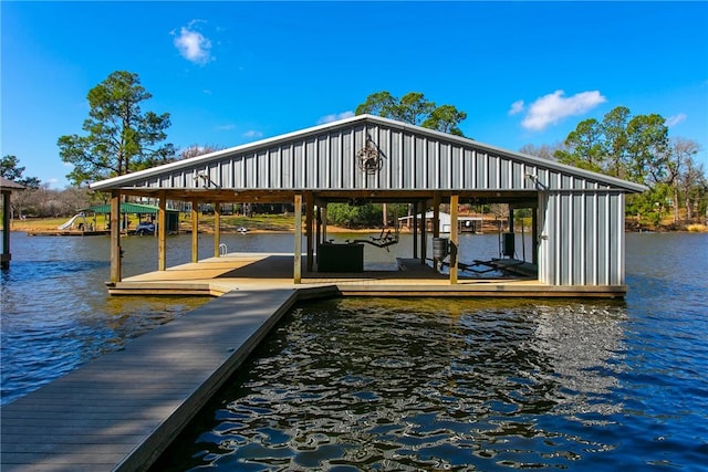 view of dock with a water view and boat lift