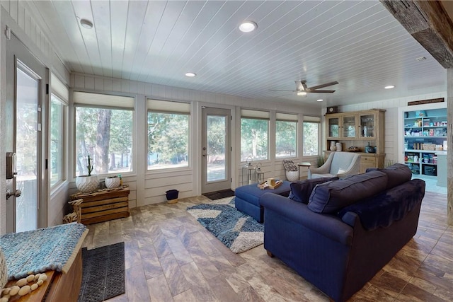 living area featuring wood ceiling, ceiling fan, and recessed lighting