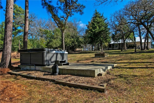 exterior space with a hot tub