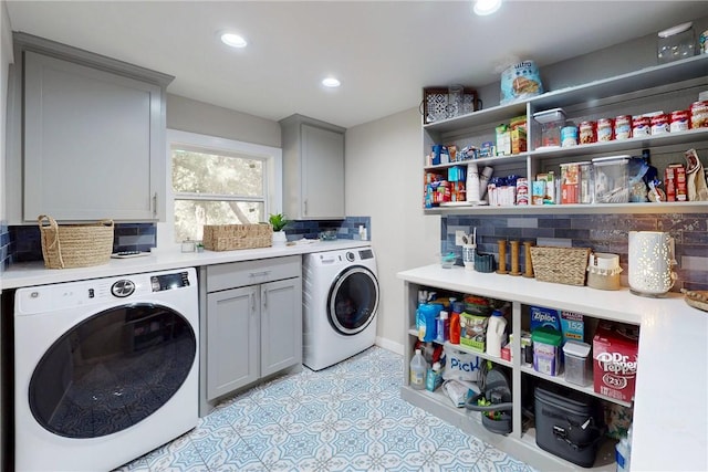 clothes washing area featuring recessed lighting, washer / clothes dryer, cabinet space, and baseboards