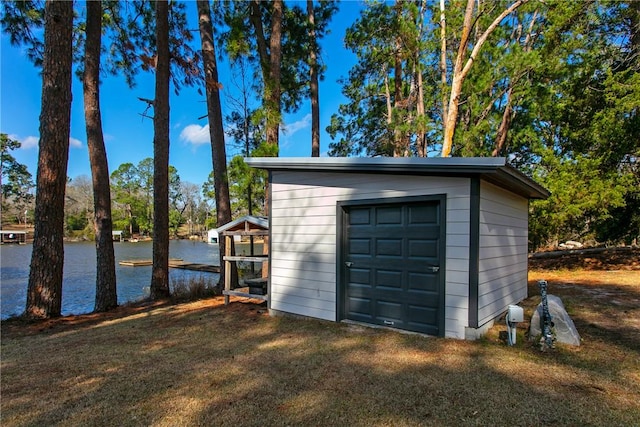 view of outdoor structure featuring a water view and an outdoor structure