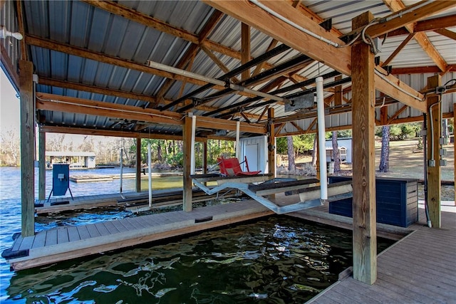 dock area with a water view and boat lift