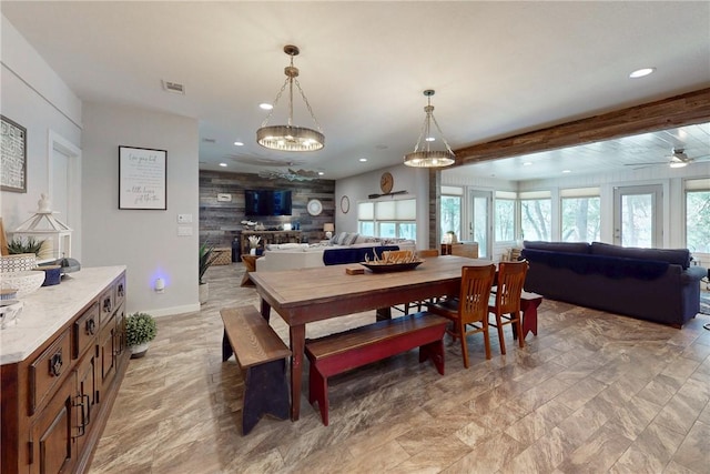 dining area with recessed lighting, an accent wall, visible vents, baseboards, and beamed ceiling