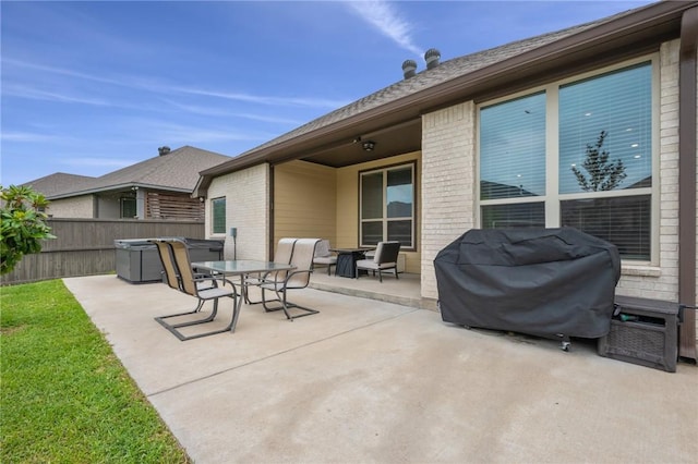 view of patio / terrace with fence, area for grilling, and outdoor dining area