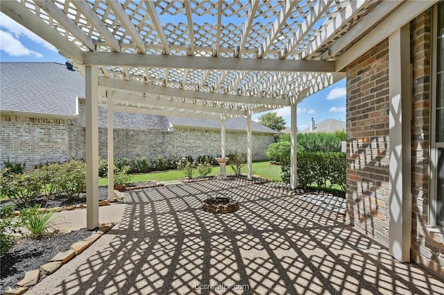 view of patio / terrace featuring a pergola and a fire pit