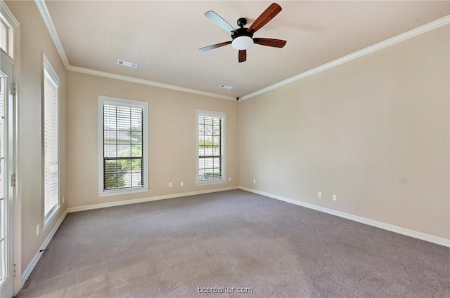 carpeted empty room featuring ceiling fan and crown molding